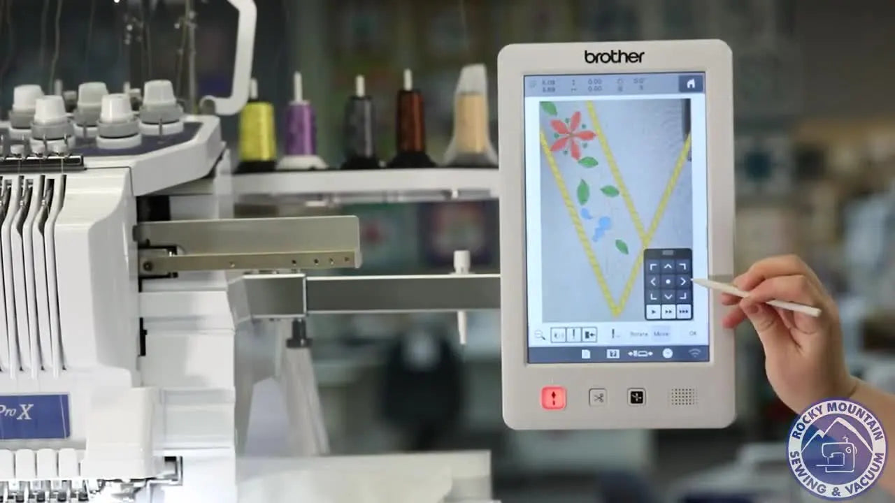 A close-up of the PR1055X screen as the stylus drags a monogram design over the live camera view for precise placement.