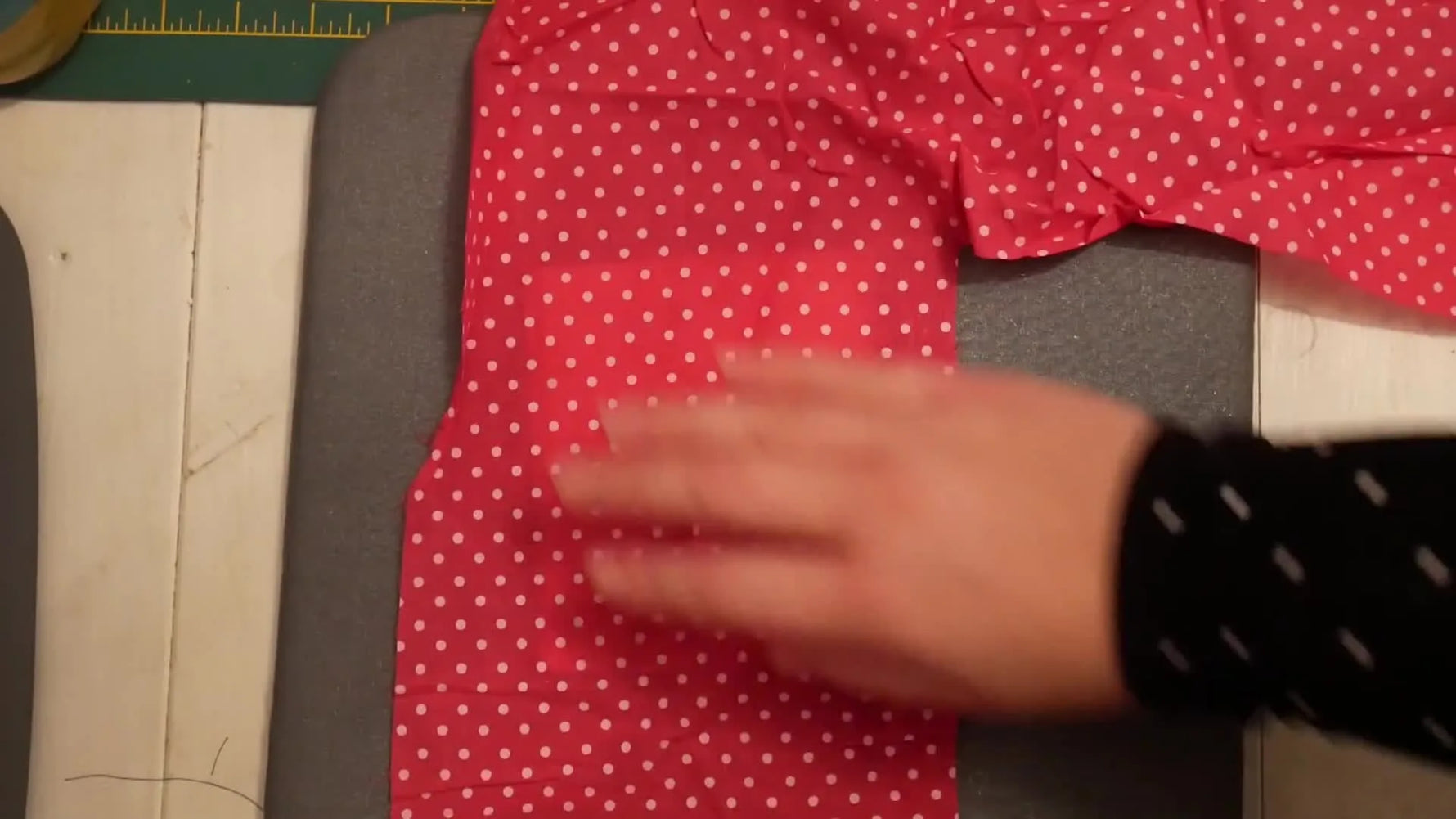 Using a Cricut EasyPress to apply iron-on adhesive to the patch.