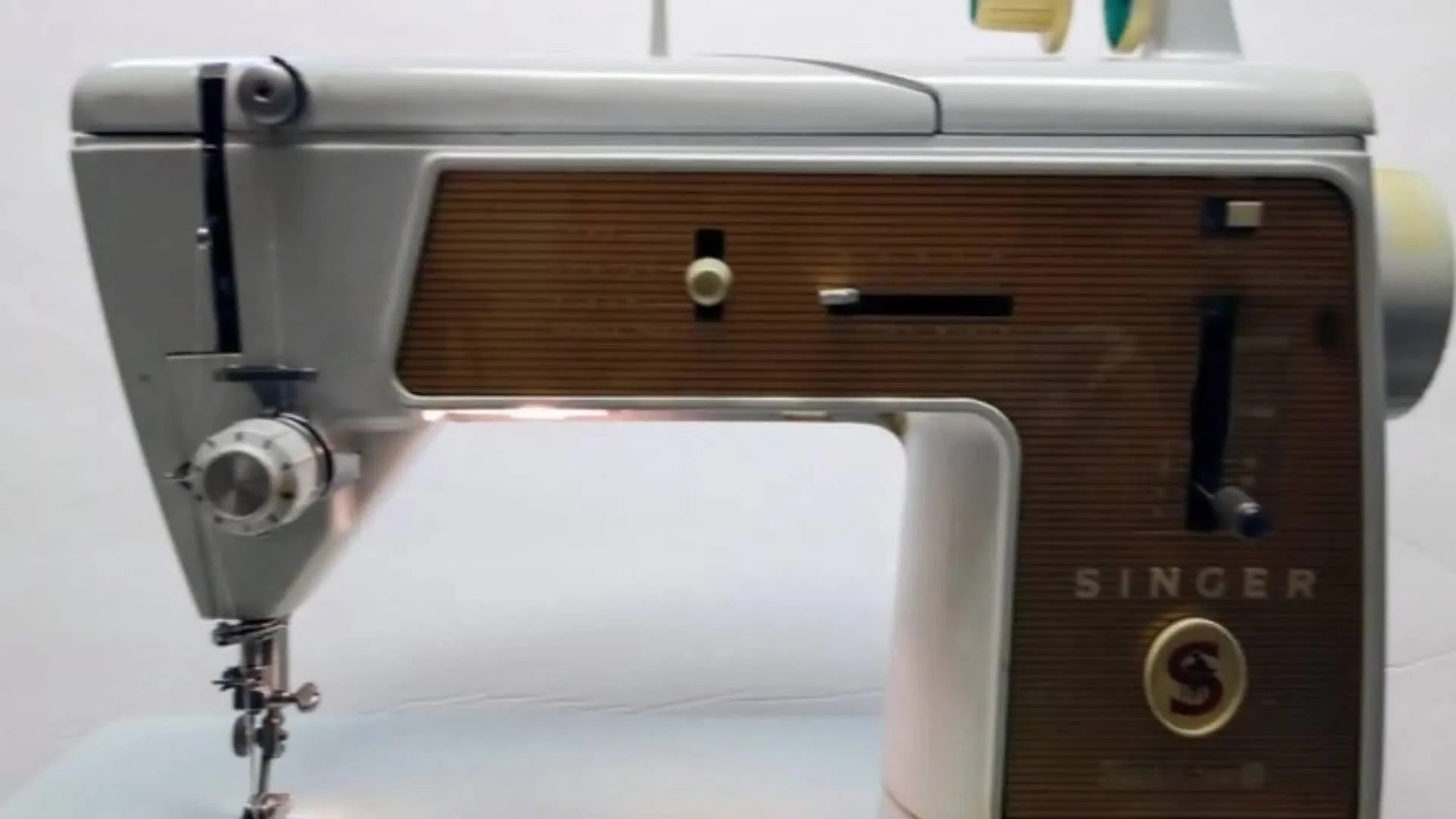 A front-facing view of the vintage SINGER Touch & Sew 603E sewing machine on a white background.