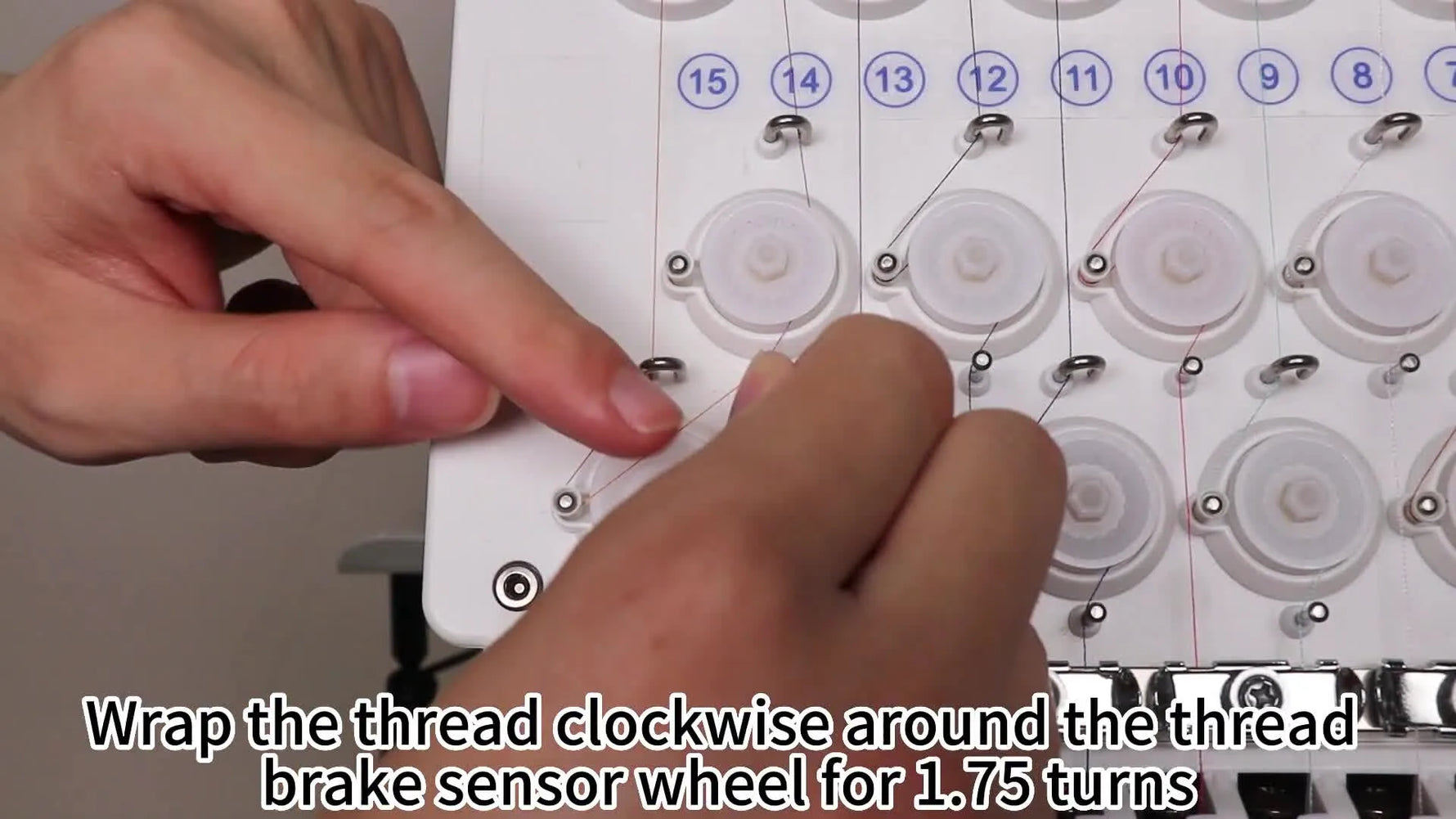 A close-up shows thread being wrapped around the Smartstitch thread break sensor wheel—the critical 1.75-turn step that prevents false breaks and messy starts.