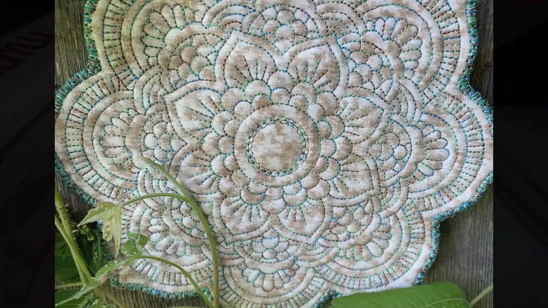 A close-up finished mandala coaster shows how variegated thread creates a premium color-shift effect across both the inner design and the satin border.