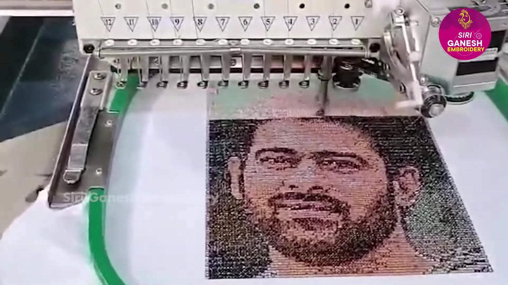 A top-down view of a nearly completed photo-realistic embroidered portrait showing smooth shading and clean registration inside the hoop.