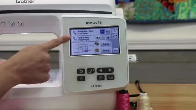 A close-up of the Brother NQ1700E screen as the embroidery foot height setting is adjusted to handle a thick in-the-hoop fabric sandwich.