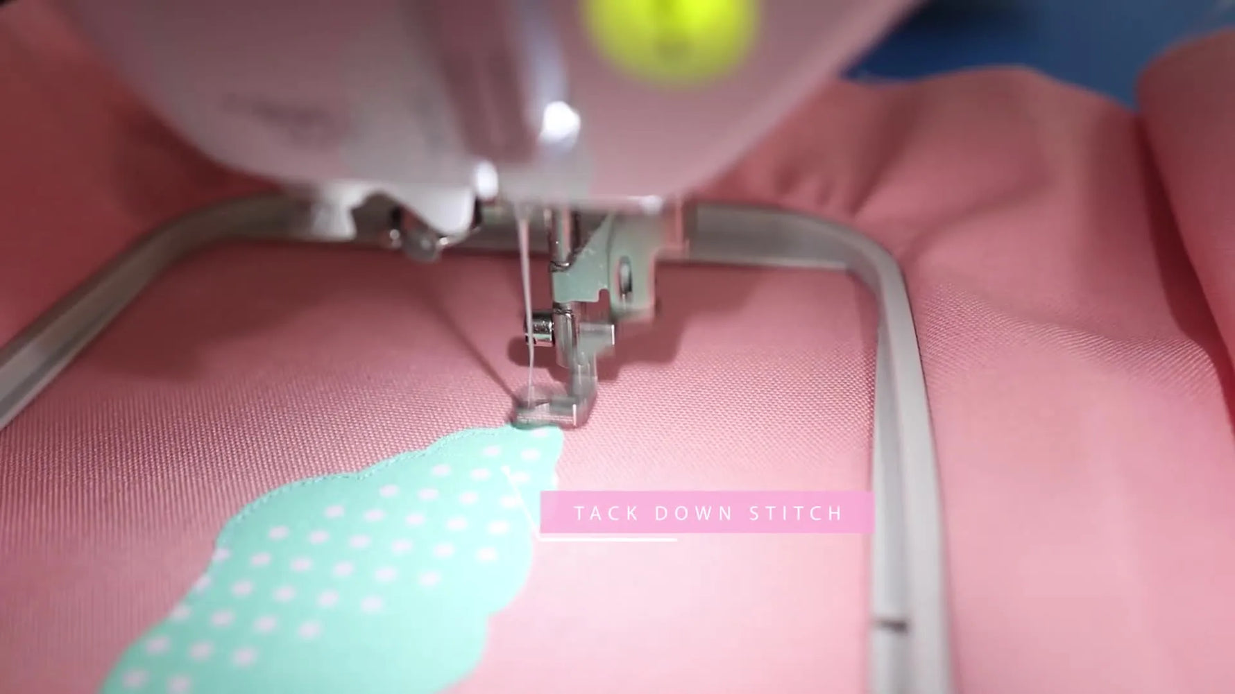 A close-up of the finished shell appliqué shows a smooth purple satin stitch fully covering the fabric edge for a clean, professional finish.
