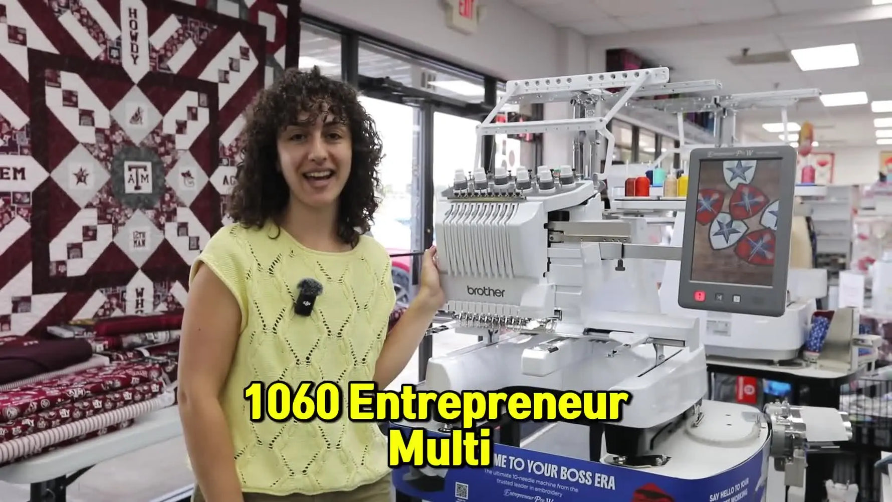 A Brother educator stands beside the Brother PR1060W 10-needle embroidery machine during a live demo.