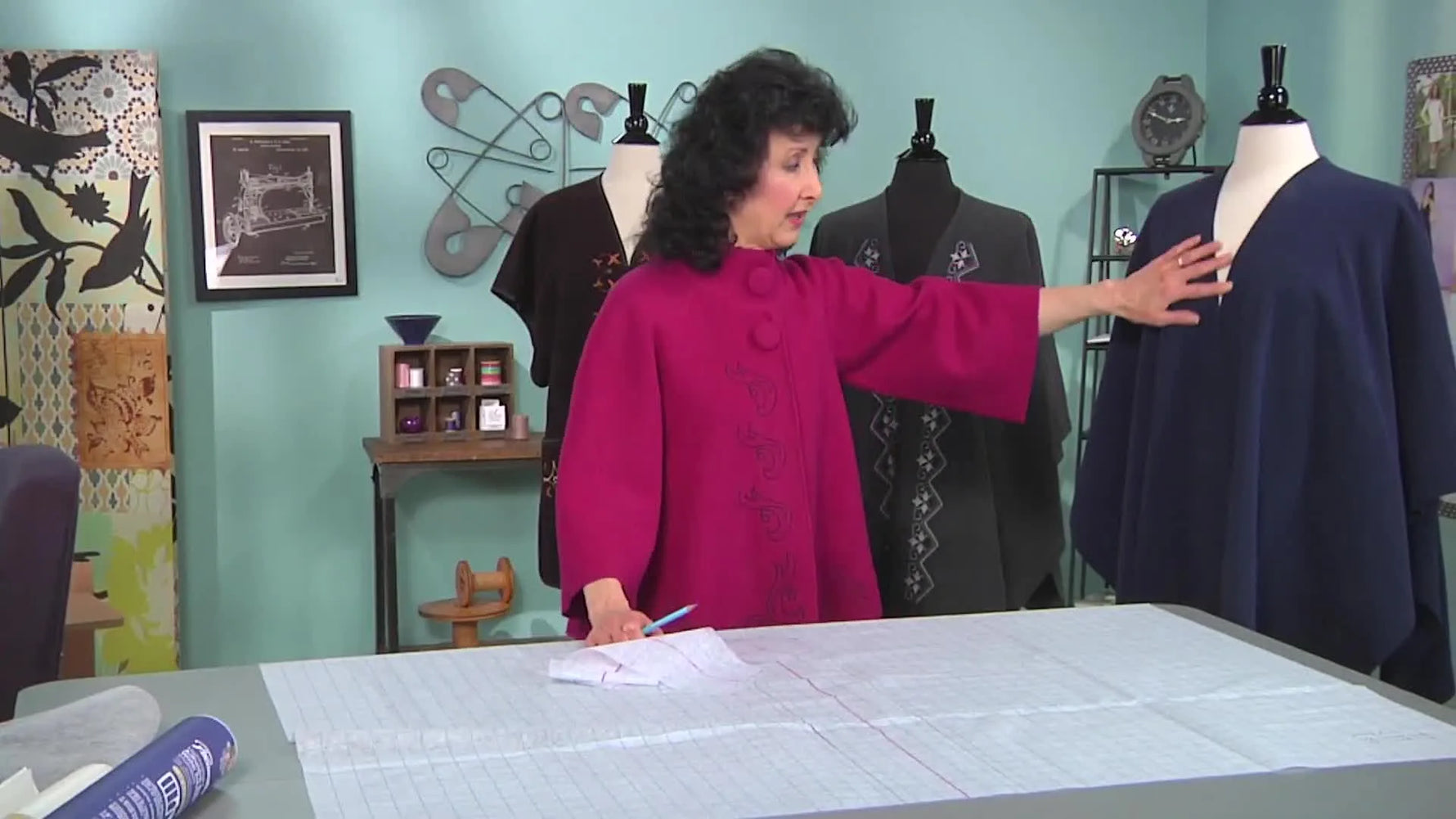 A blue fleece Ruana wrap draped on a mannequin, showing the neckline opening and soft drape that makes this project so wearable.