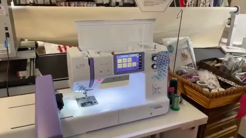 Front view of the Bernette 79 Yaya Han Edition with the embroidery module attached, ready for an embroidery demo.