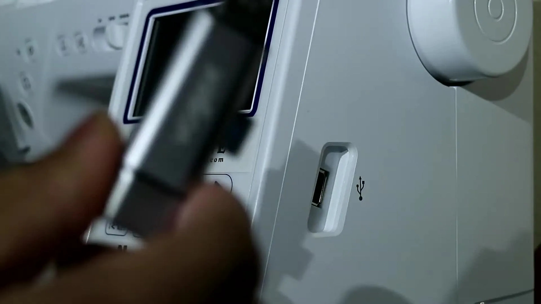 A close-up shows a USB flash drive being inserted into the side port of a Brother embroidery machine, ready to load a design.
