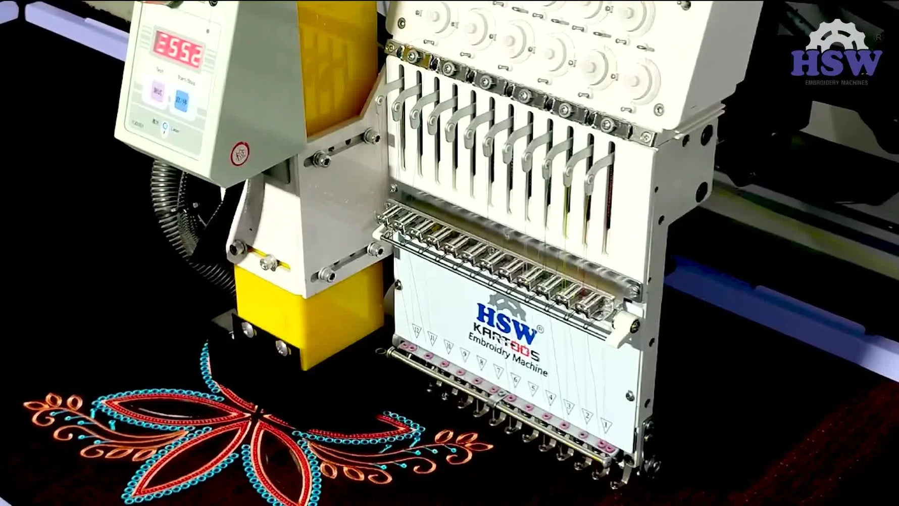 A close-up of the laser actively cutting the applique outline with visible smoke rising from the cut path.