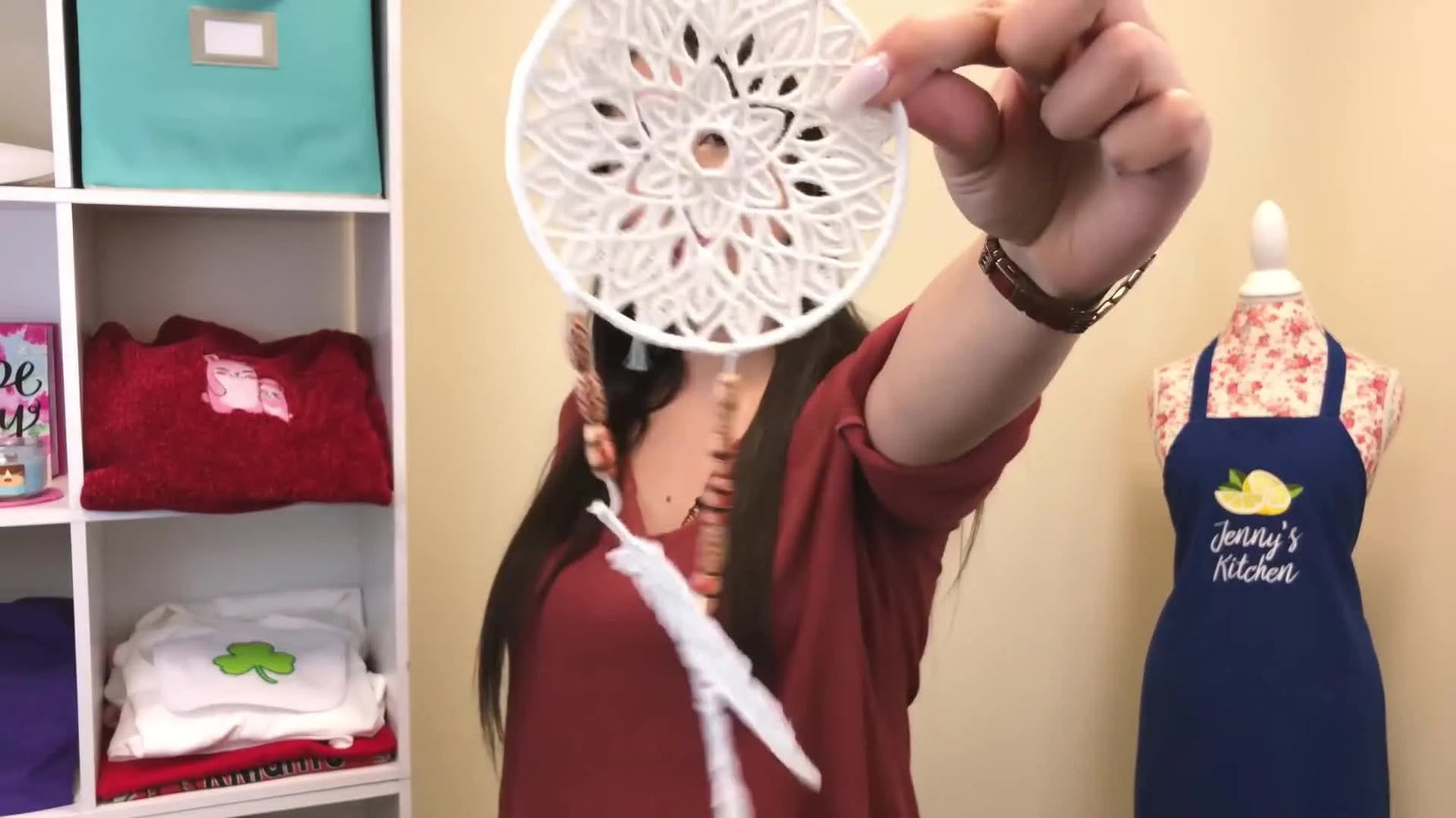 A finished white free-standing lace dreamcatcher is held up to show its clean, backing-free look from both sides.