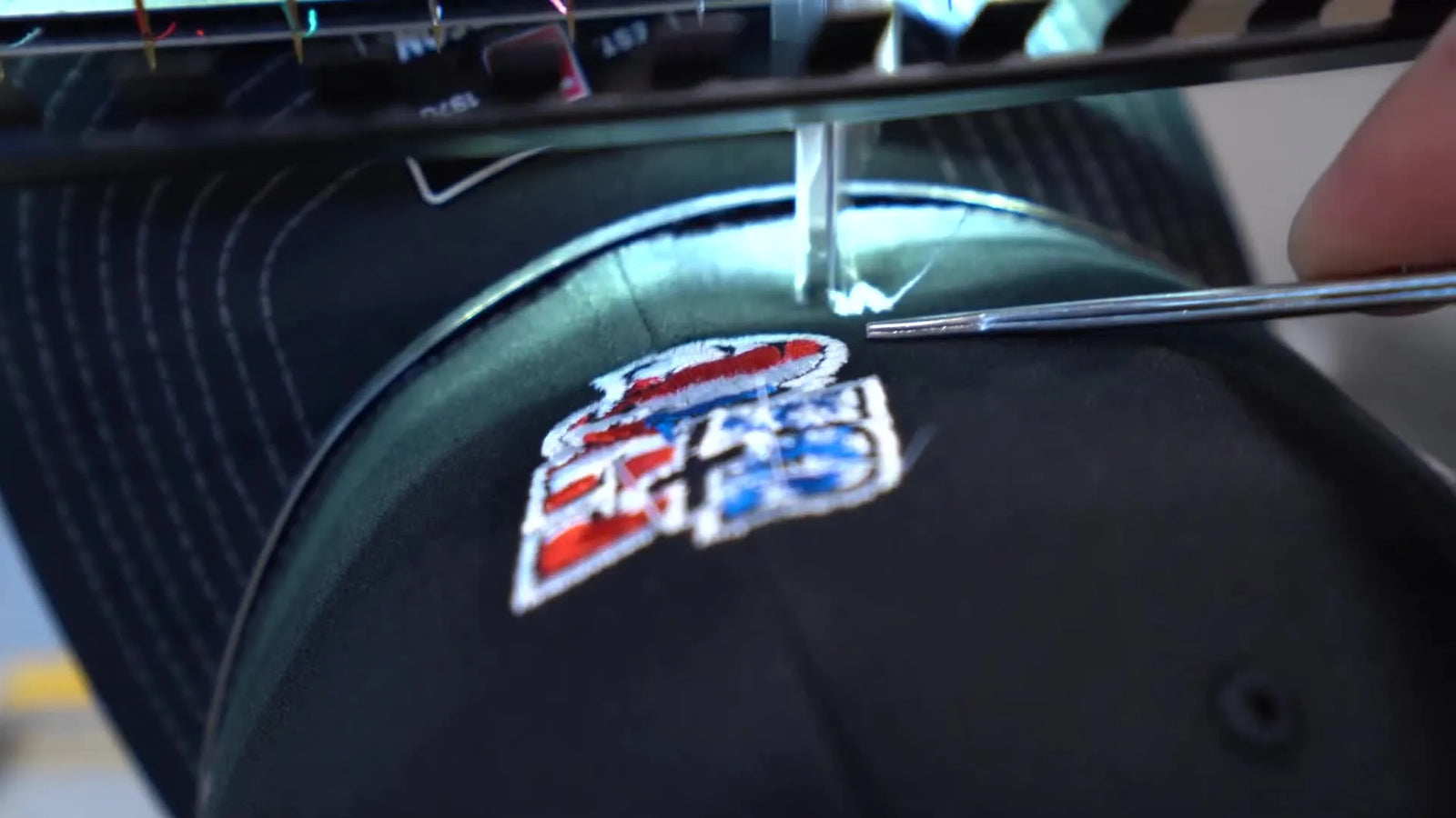 Stop Your Melco EMT16X From Smacking the Brim: Clean Hat Hooping, Low Logo Placement, and the Tweezer Trick That Saves Runs