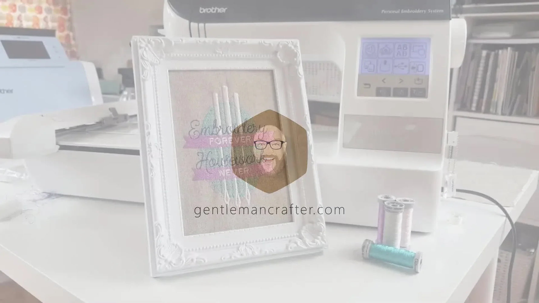 A framed embroidered piece next to a Brother Innov-is 750E embroidery machine.