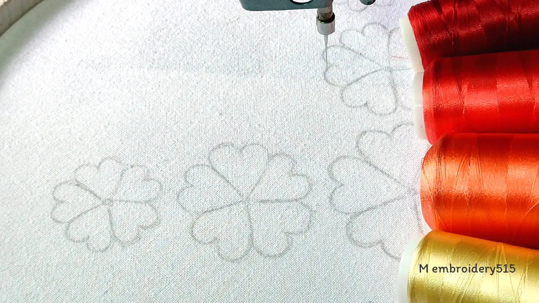 Embroidery machine ready with fabric and threads