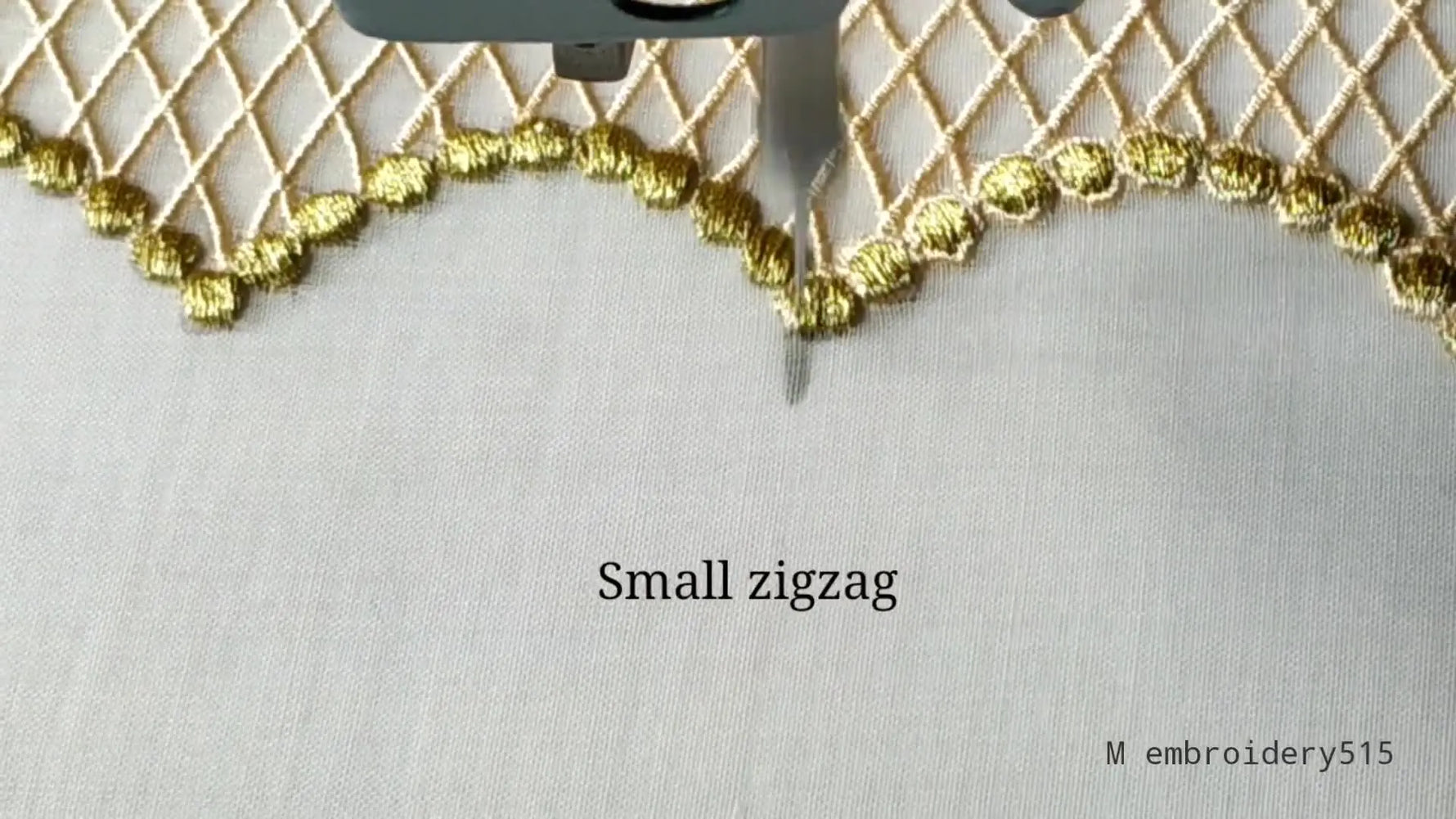 Finished embroidered cut work lace piece with gold thread and small zigzag stitches.