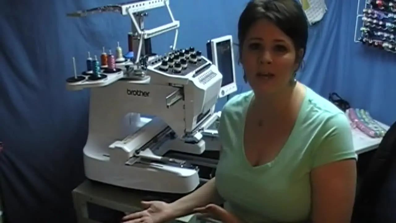 Whitney gestures toward a Brother 10-needle embroidery machine, signaling the jump from hobby stitching to production-ready workflow.