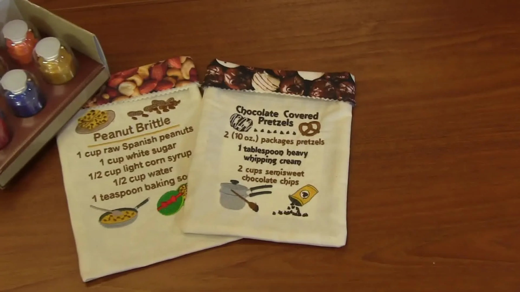 A close-up of the recipe bag embroidery text on chocolate-print fabric, showing how readable lettering can look when the fabric and stabilization are chosen well.