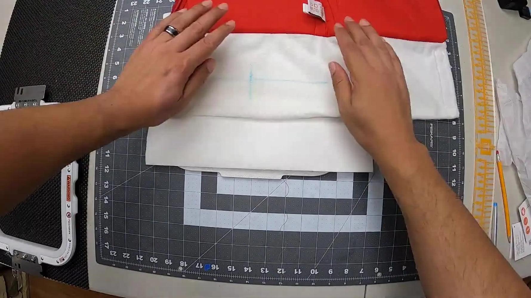 Hands snap a magnetic 8x9 hoop onto a thick plush stocking cuff, showing how easily bulky holiday fabric can be hooped flat and centered.