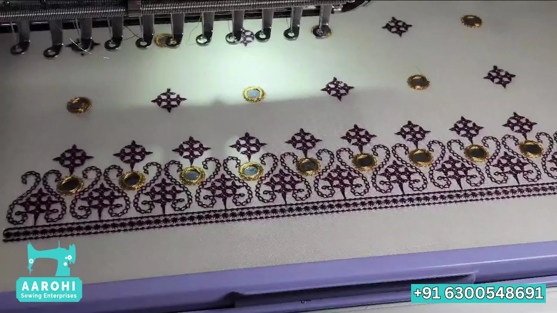 A wide-angle view of a Fortever multi-needle embroidery machine actively stitching a design with the hoop and table fully visible.
