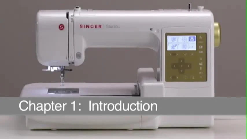 A full view of the Singer Studio embroidery machine set up on a clean surface, ready for a first-day parts check and basic tour.