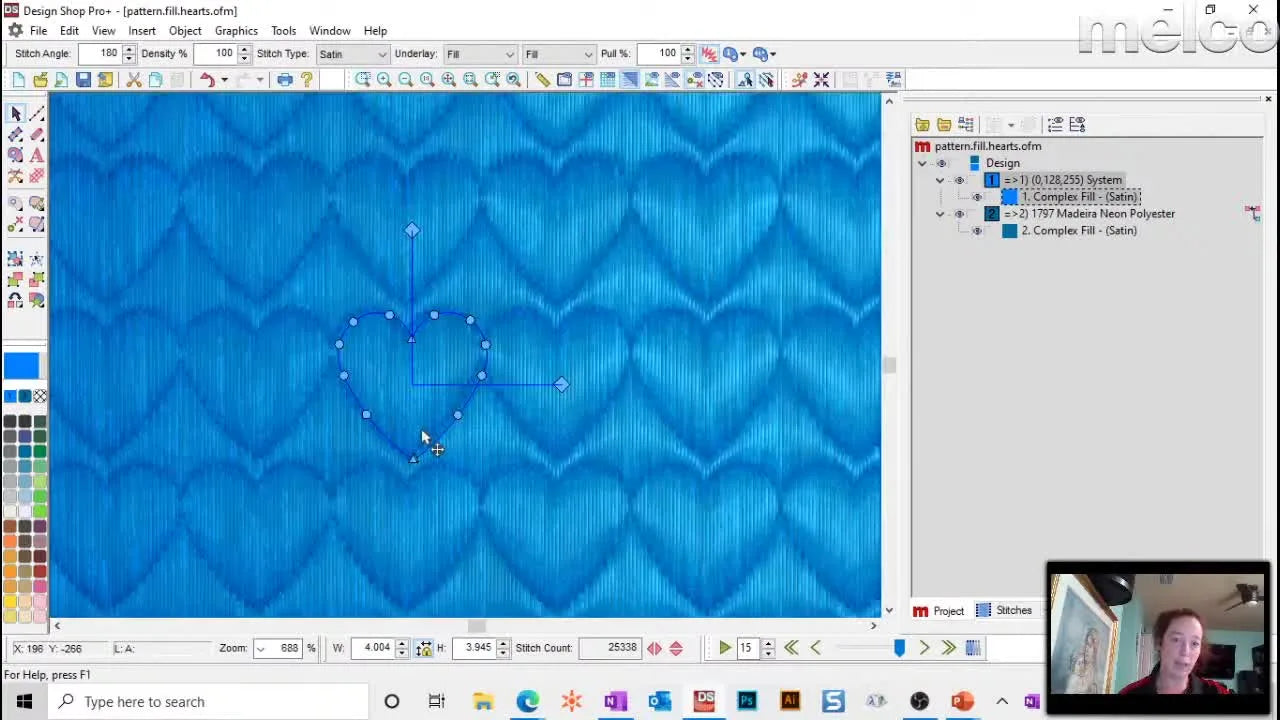 A DesignShop v11 screen capture showing heart pattern-fill handles being adjusted for angle, spacing, and scale.
