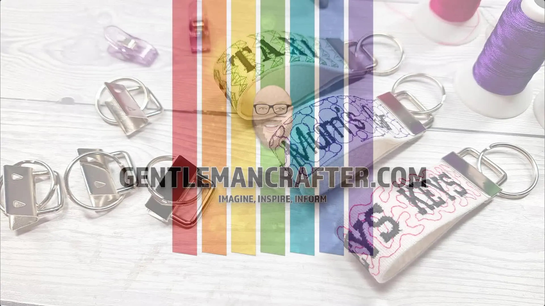A neat spread of finished embroidered key fobs on a white tabletop, showing clean edges, consistent stitching, and ready-to-sell hardware.
