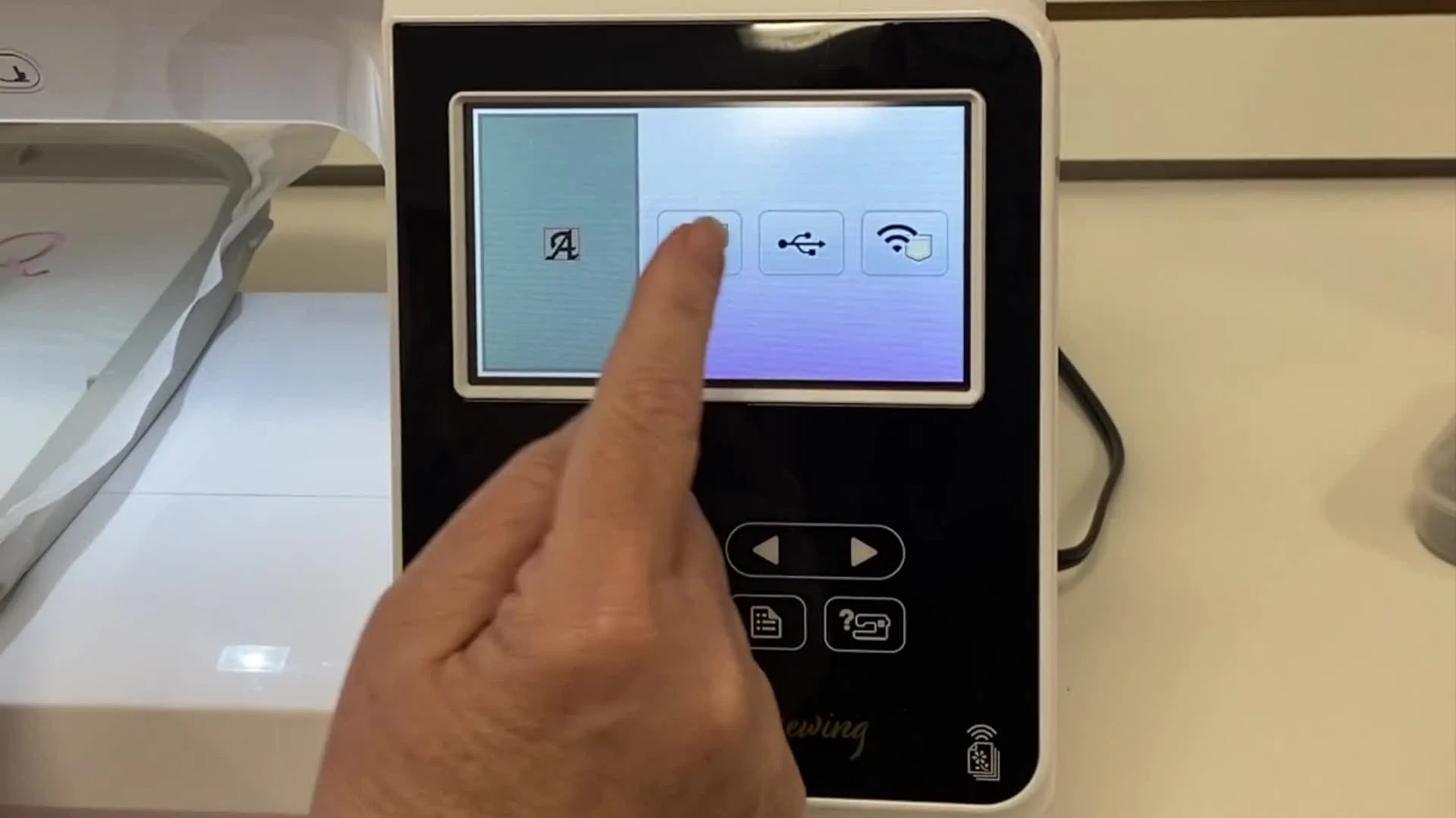 The Baby Lock Flare screen shows a second design being added to an existing letter, demonstrating how to combine elements directly on the machine.