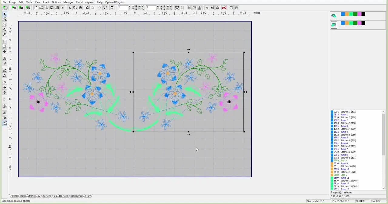 A mirrored floral spray layout fills the screen as a symmetrical header-style embroidery design ready for a hoodie back or blanket.
