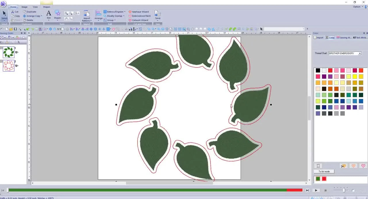 A completed fall leaf wreath arrangement centered on the PE Design 10 workspace, ready to be turned into a quilt square.