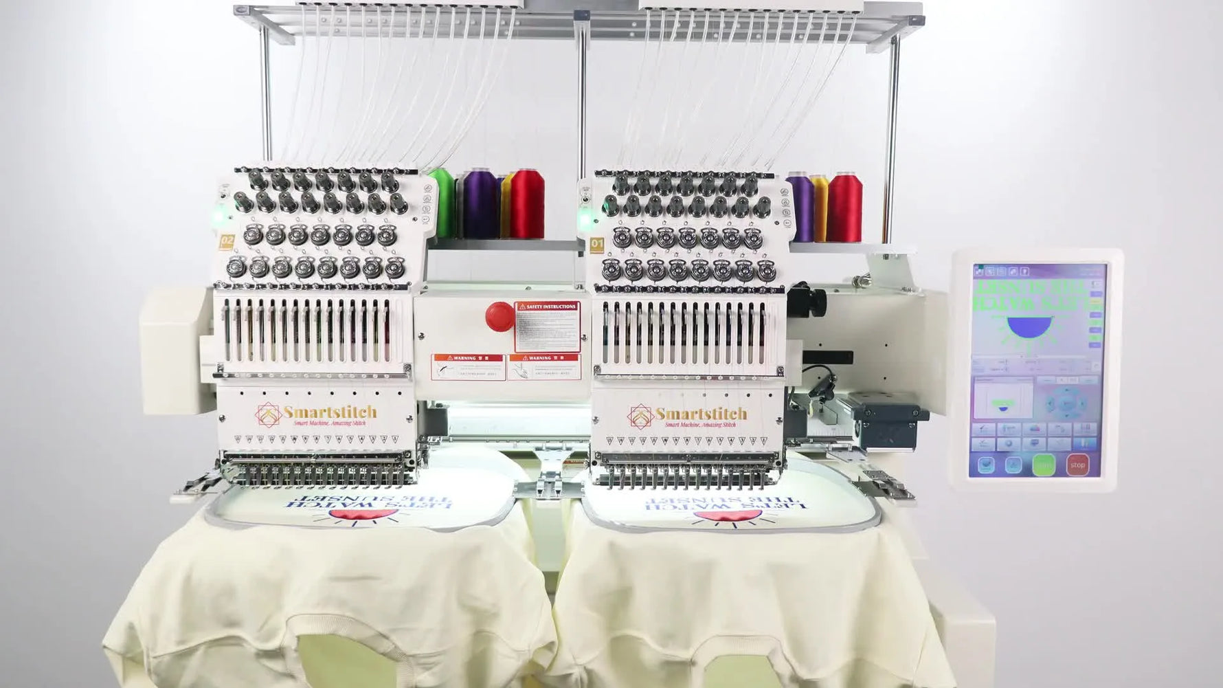 A wide view of a Smartstitch dual-head embroidery machine with hoops installed and ready for production.