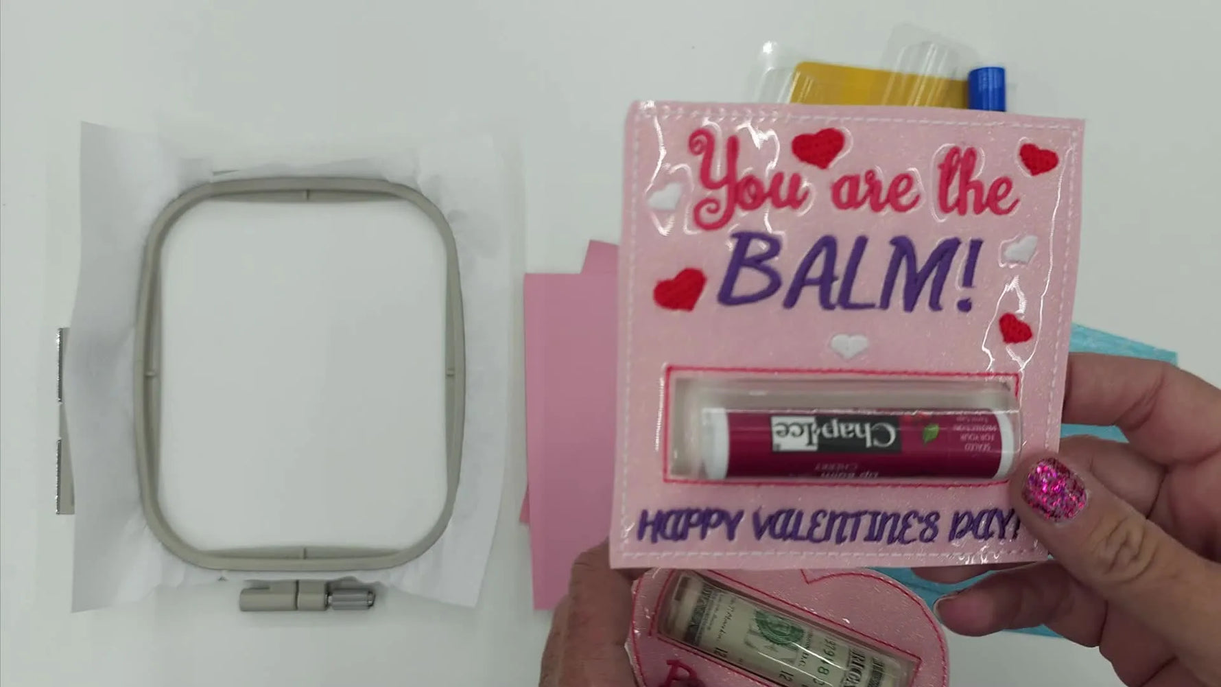 A close-up of the finished pink heart lip balm holder with the dome installed and the item neatly seated inside.