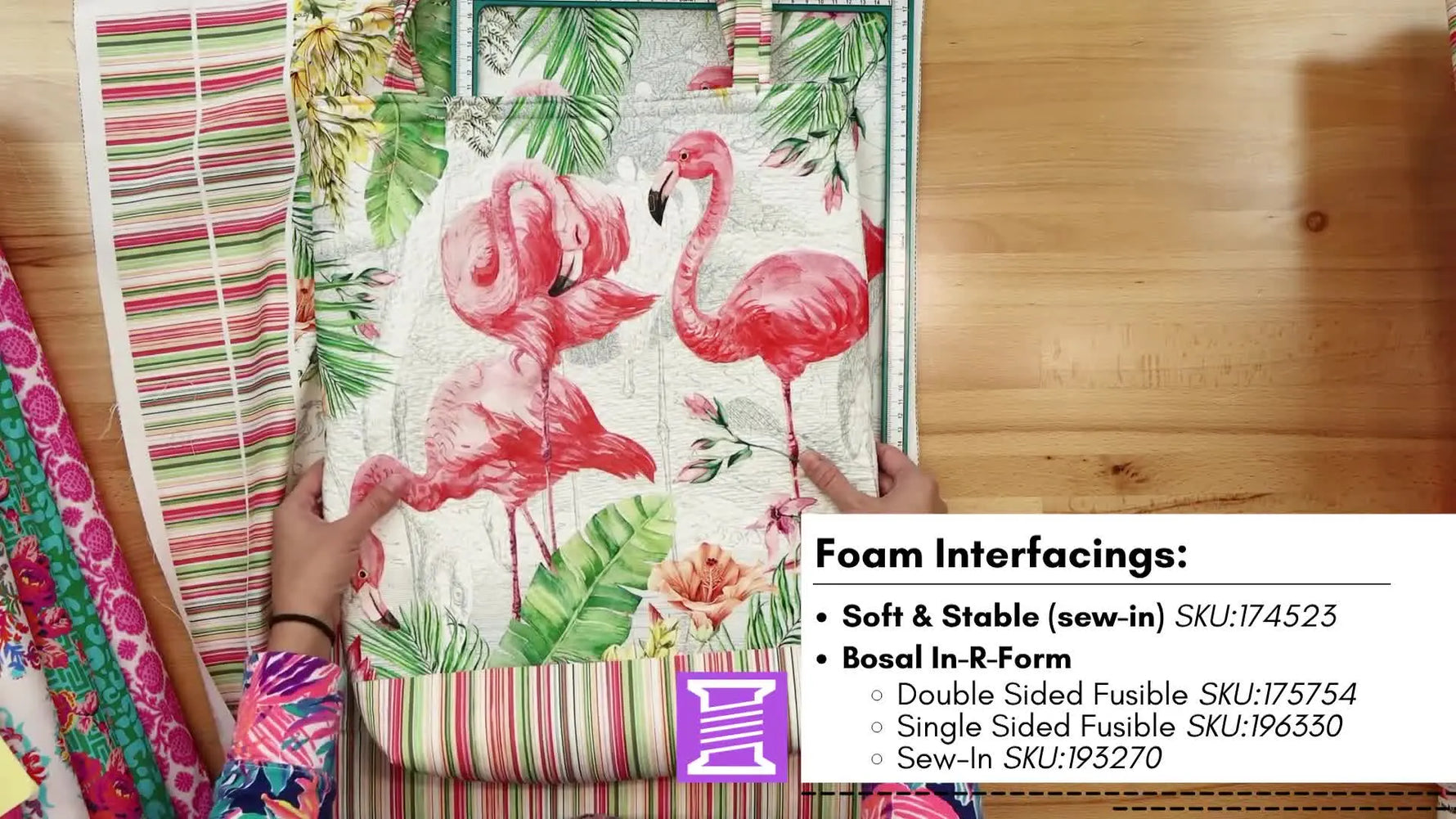 A printed Flamingo Bay fabric panel is secured with Bosal foam inside a magnetic hoop, ready to be scanned and quilted on the Baby Lock Solaris 2.