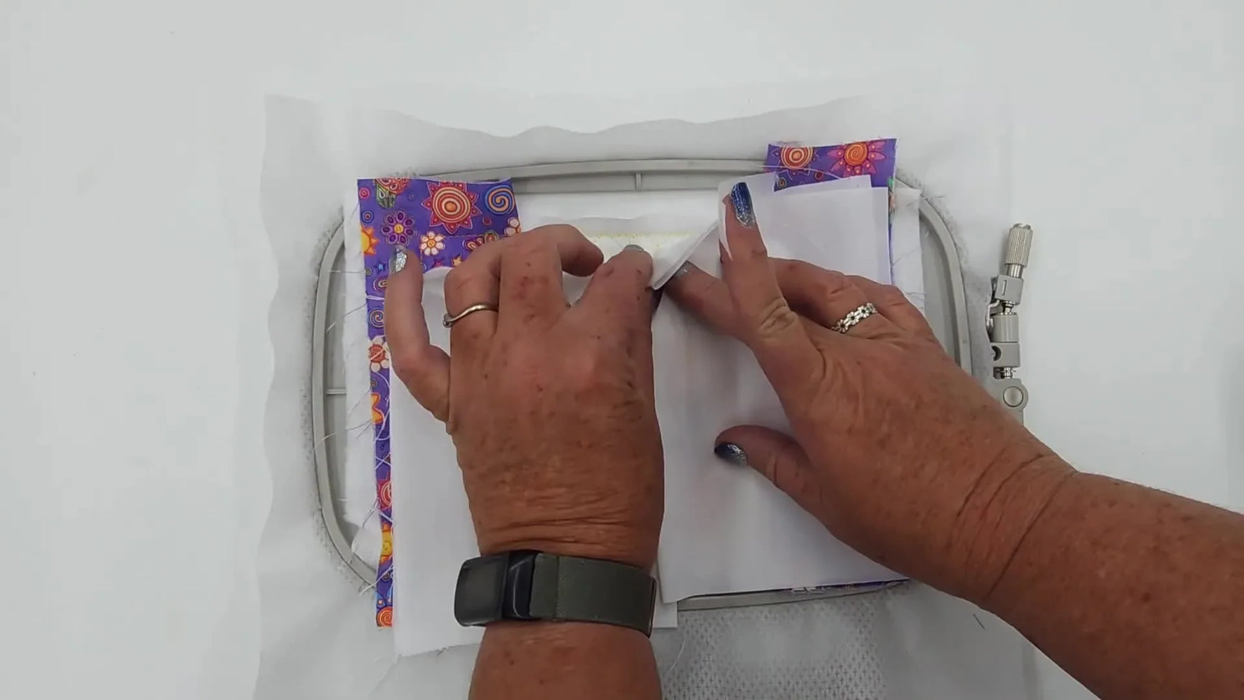 A close-up shows tape pressed over the overlapping envelope-backing seam so the presser foot glides across without catching.