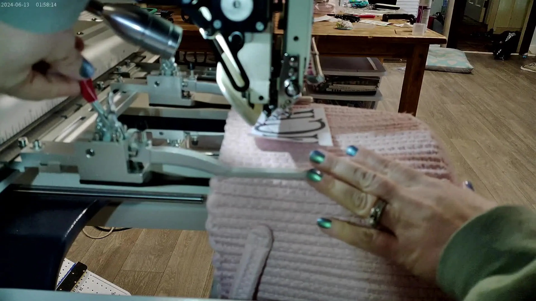 Close-up of the rope basket being locked into the Shoe Device clamp by pushing down the side levers.