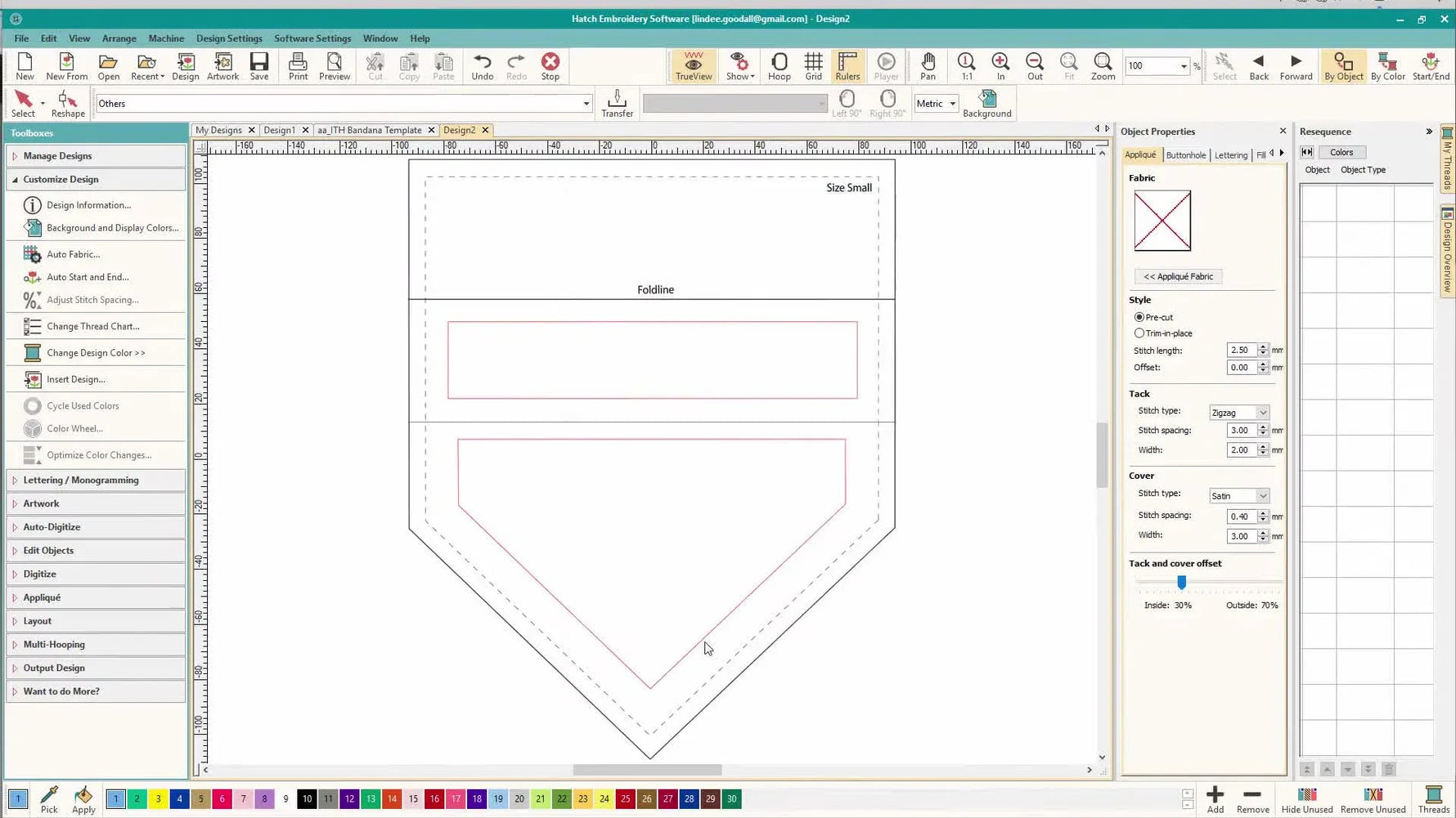 A dog bandana template is displayed in the Wilcom Hatch workspace with clear cut, seam, and placement guides for accurate design positioning.