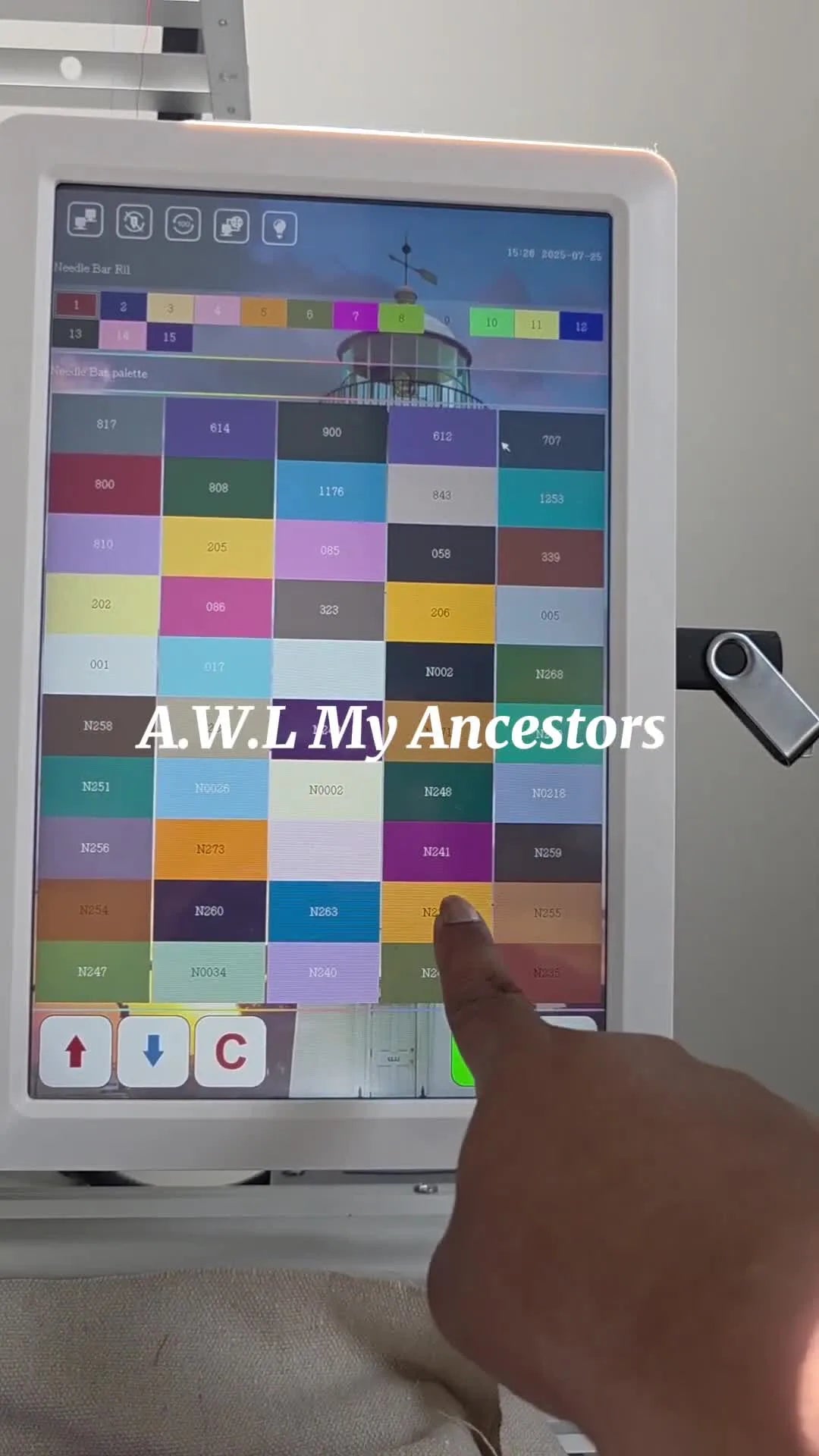 The Smart Stitch touchscreen displays the expanded Design Display Color grid with numbered color codes after a successful update.