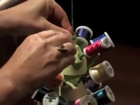 A fully assembled Clover Stack ’n Stitch Thread Tower loaded with colorful spools, ready to feed smoothly into an embroidery machine.
