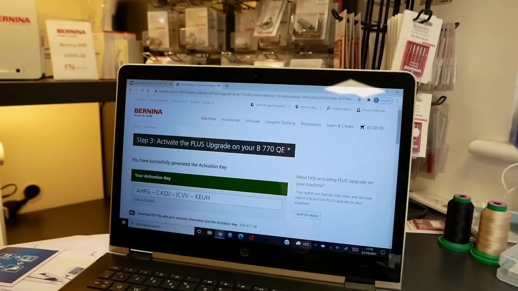 A laptop screen displays the newly generated BERNINA activation key needed to enable the 770 QE PLUS upgrade.