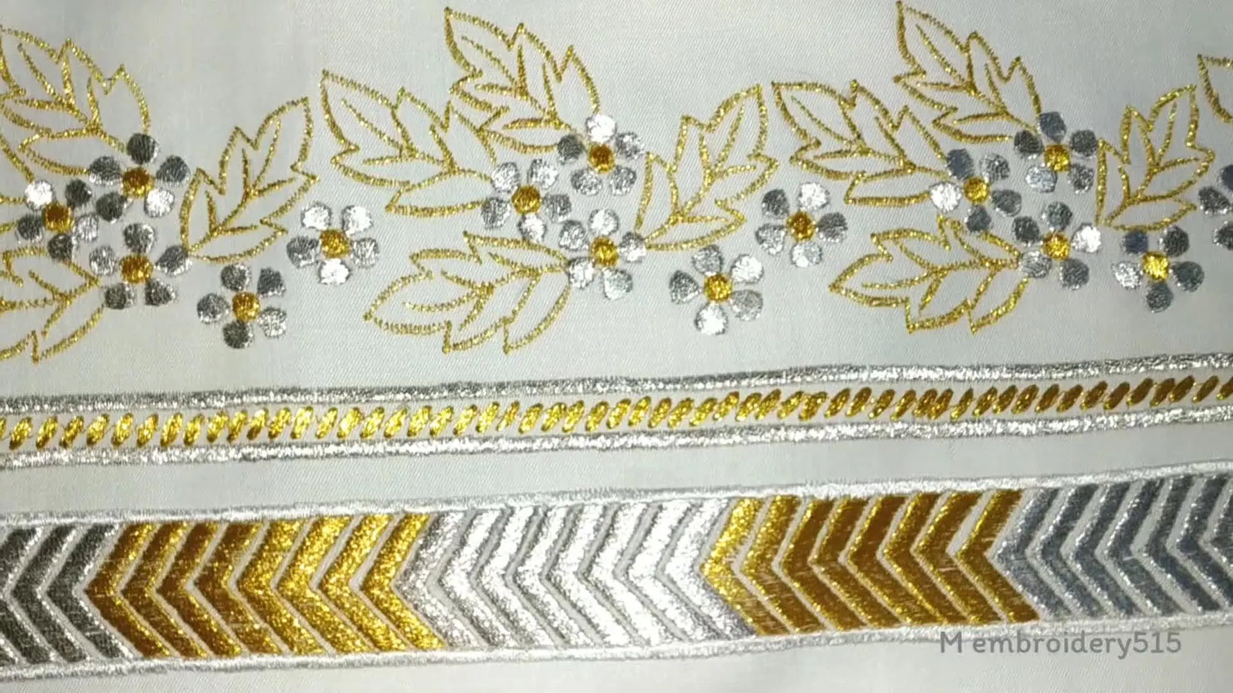 Completed machine embroidered border design with flowers