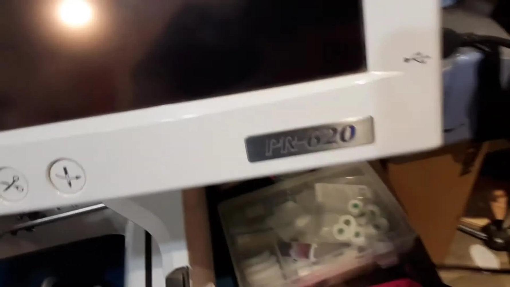 A USB extension cable is plugged into the side USB port of a Brother PR-620 LCD panel, ready to take the daily wear instead of the machine’s built-in port.