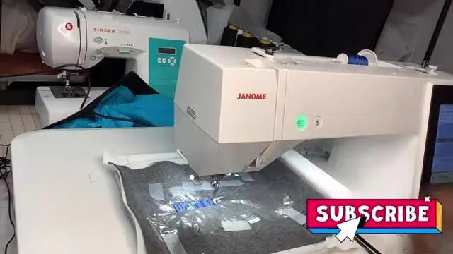The Janome Memory Craft 500e stitches the final letters cleanly after the hidden upper-thread jam is cleared.