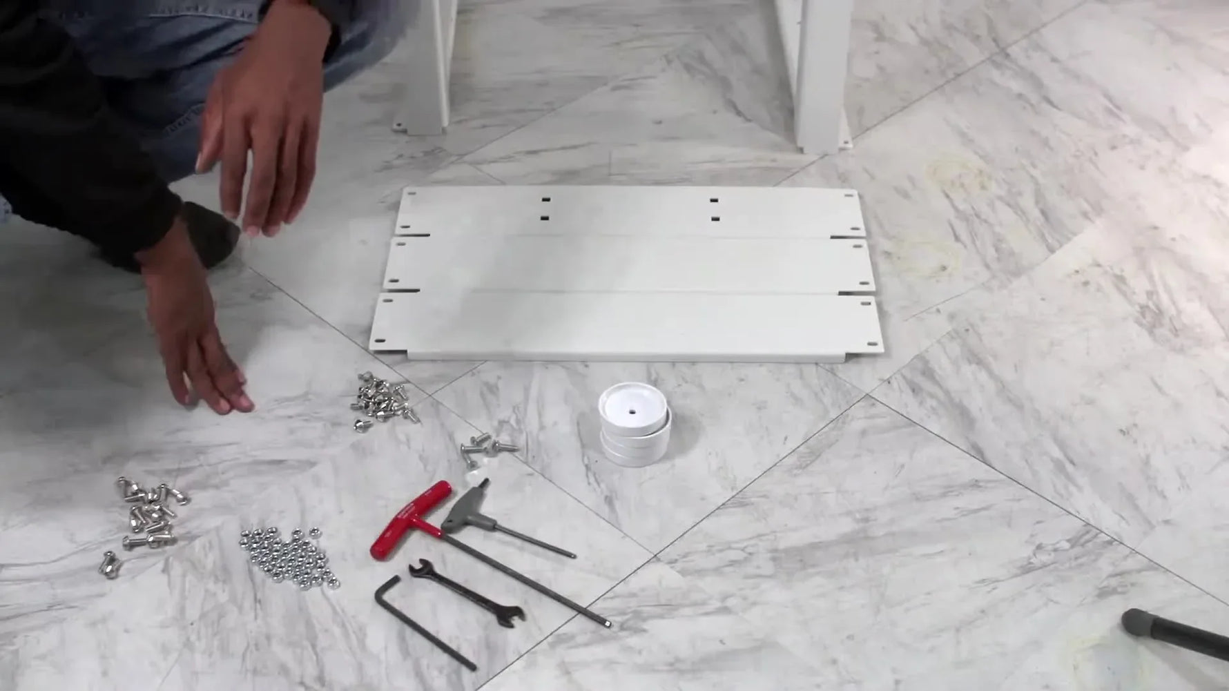 Overview of tools and components for embroidery machine stand assembly