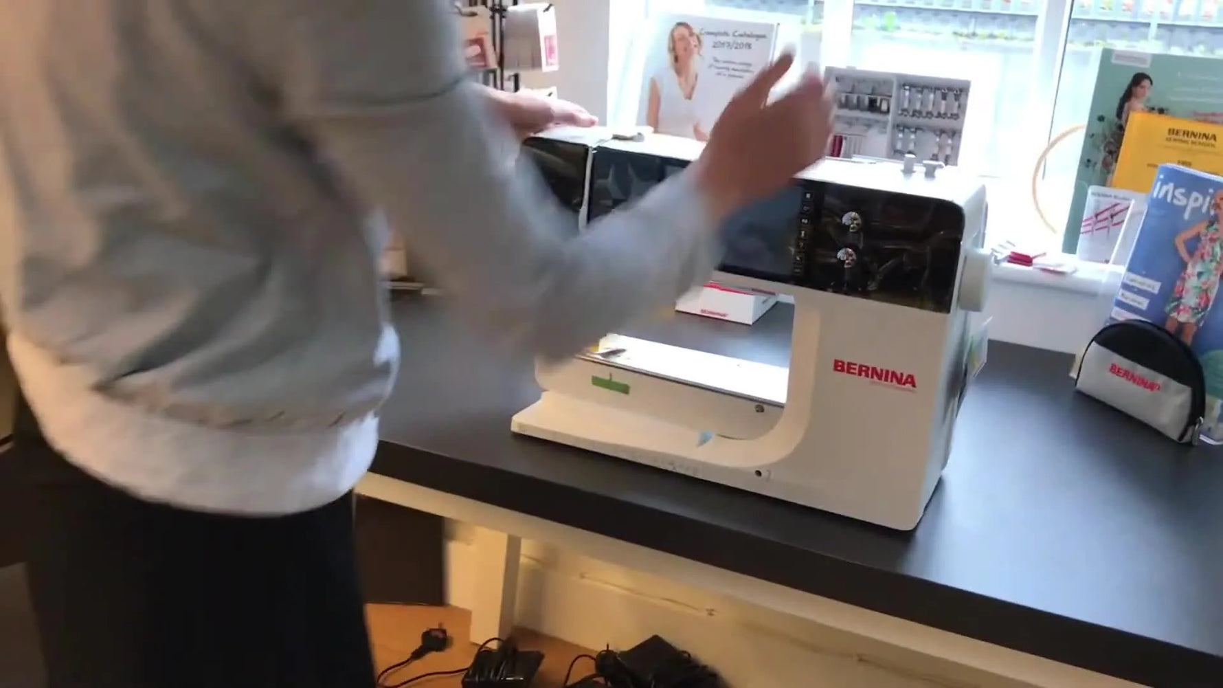 The BERNINA 790 Plus sits fully revealed on a worktable, ready for embroidery setup.