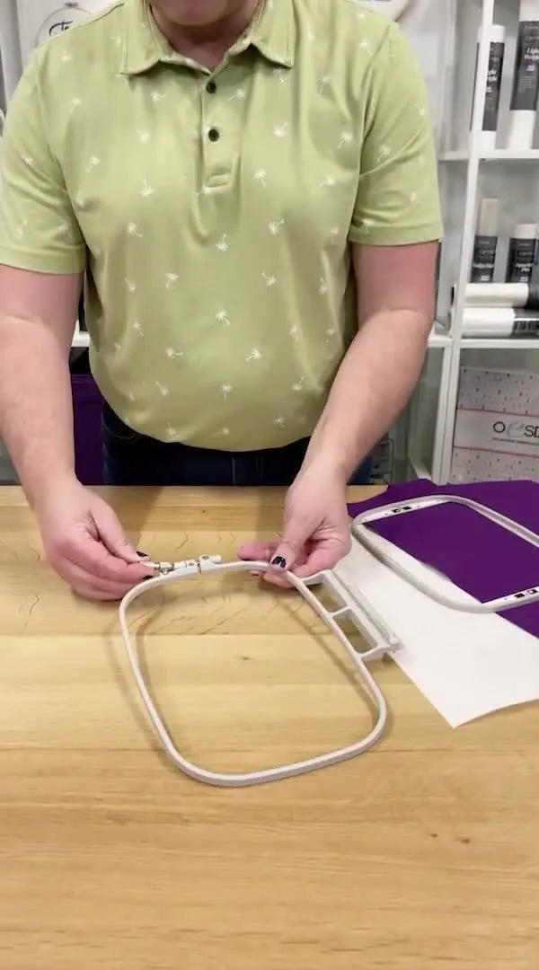 A close-up of the hoop tension screw being turned exactly a half turn to dial in consistent hoop tension without hand strain.