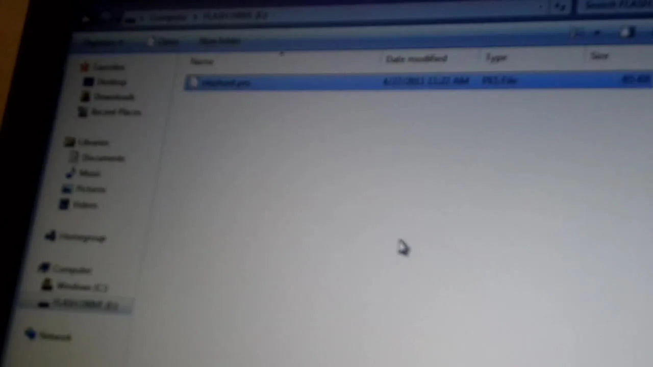 A Windows File Explorer window shows the embroidery .PES file successfully copied onto a USB flash drive, ready to load into a Brother PE770.