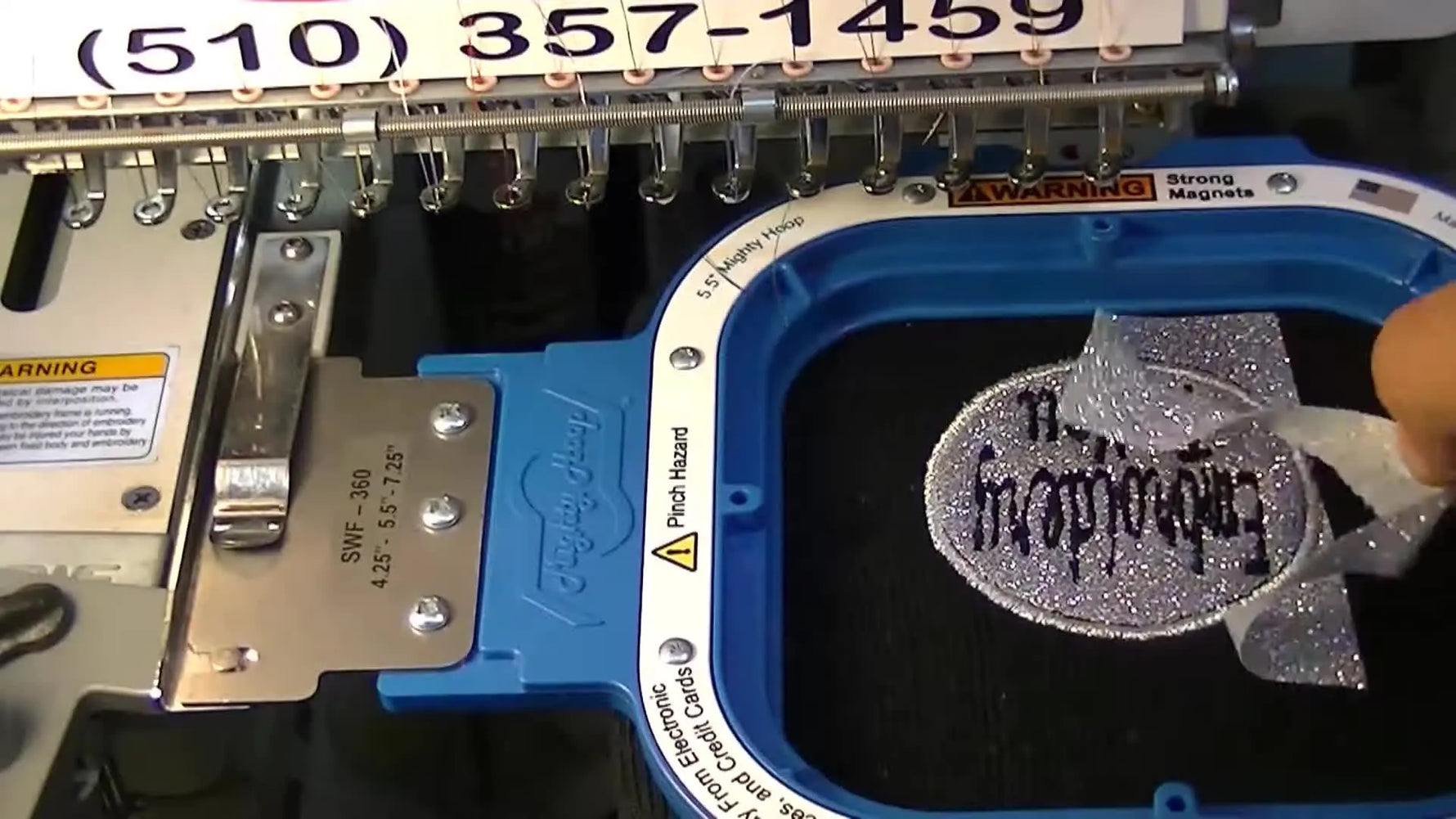 A close-up shows the excess silver Glitter Flake tearing away cleanly from the stitched circle on a black knit beanie.