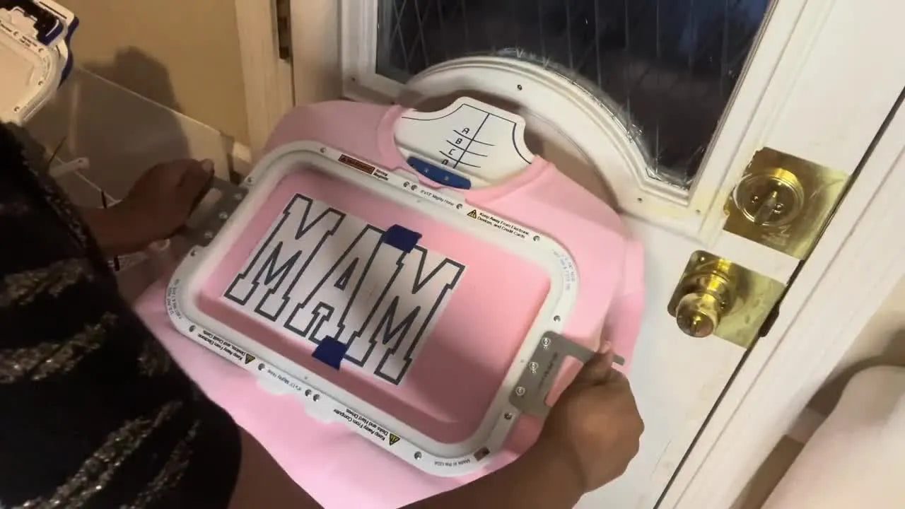 A thick sweatshirt is snapped securely into a magnetic hoop on a hooping station, showing the fast, even clamping that makes sweatshirt embroidery easier.