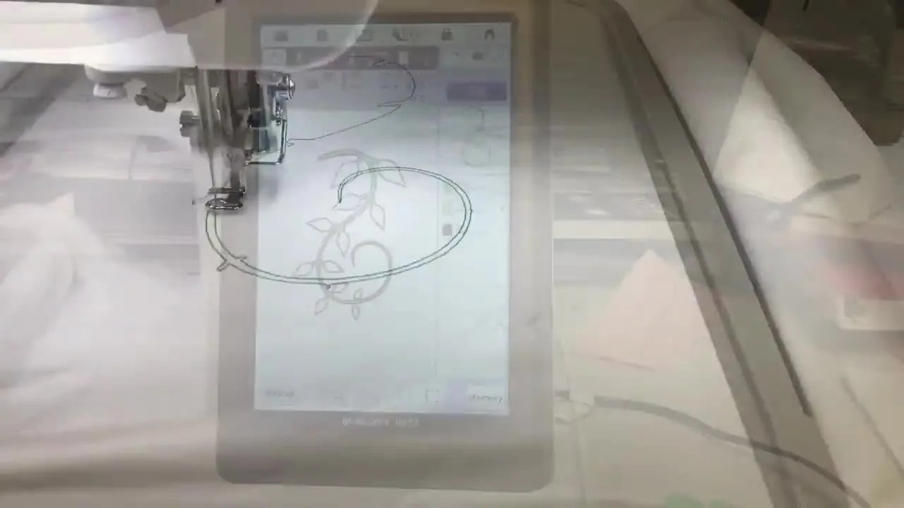 An extreme close-up shows the Baby Lock Destiny II stitching a decorative rose fill inside a leaf, highlighting how clean scan prep and closed shapes translate into crisp texture.