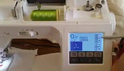 Close-up of the Brother Innov-is 1250 screen where the stitch counter is backed up using the needle minus button to repair a thread break.