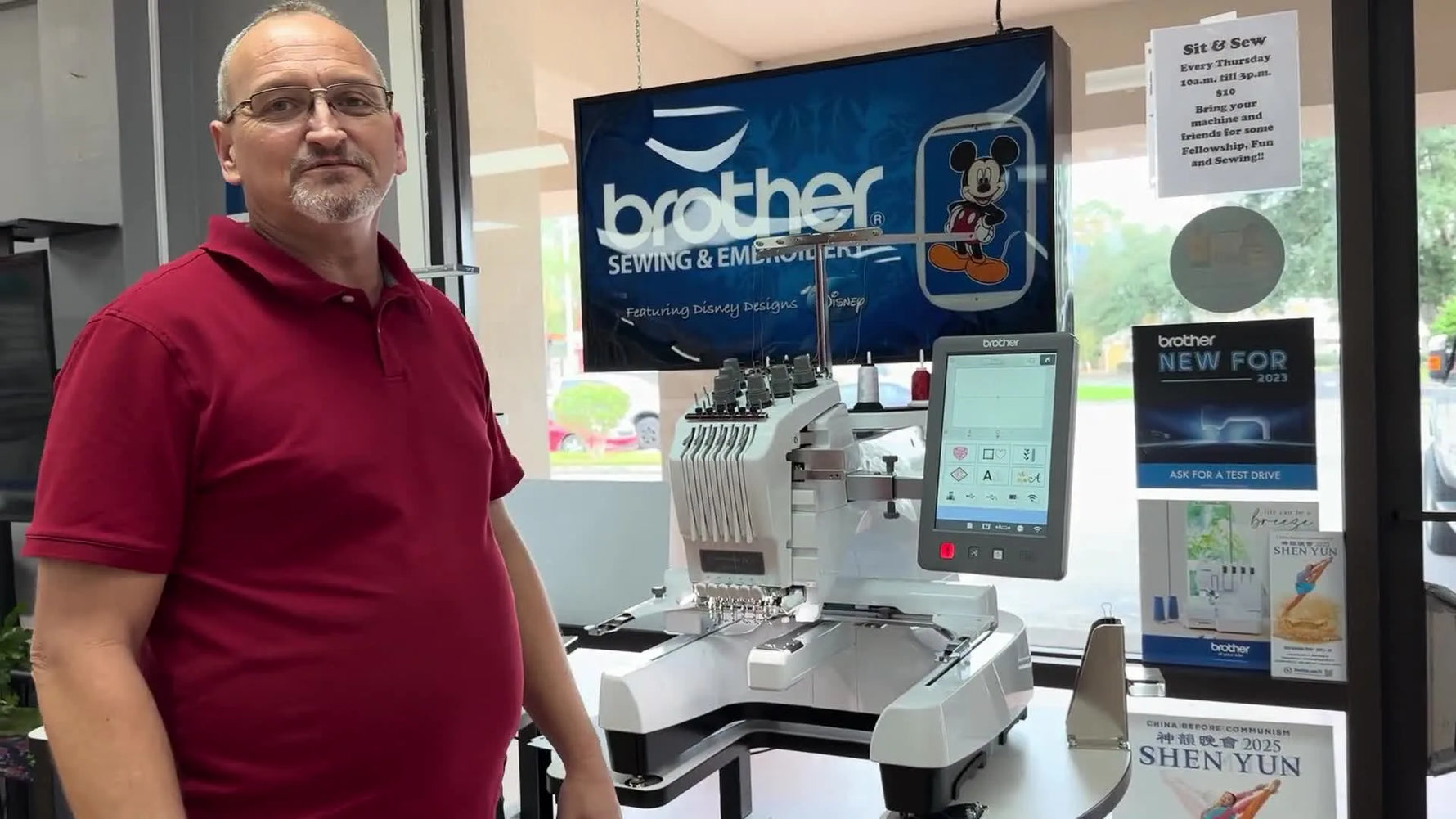A full view of the Brother PR680W 6-needle embroidery machine with the presenter standing beside it during the initial overview.