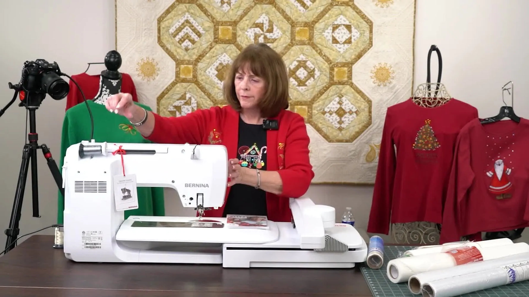 An external weighted thread stand is shown set up to feed metallic thread smoothly into the embroidery machine.
